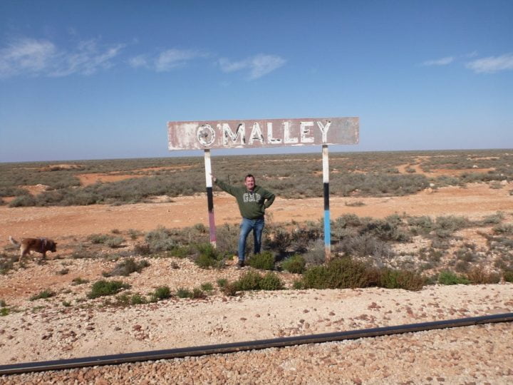 Tony Flaherty at the O'Malley siding sign in 2020